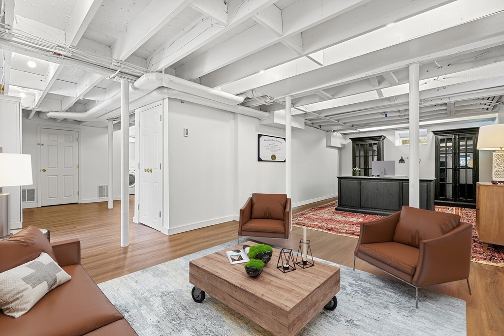 254 Commonwealth Avenue Newton, MA 02467 - Photo 30 of 37 a living room with furniture and wooden floor