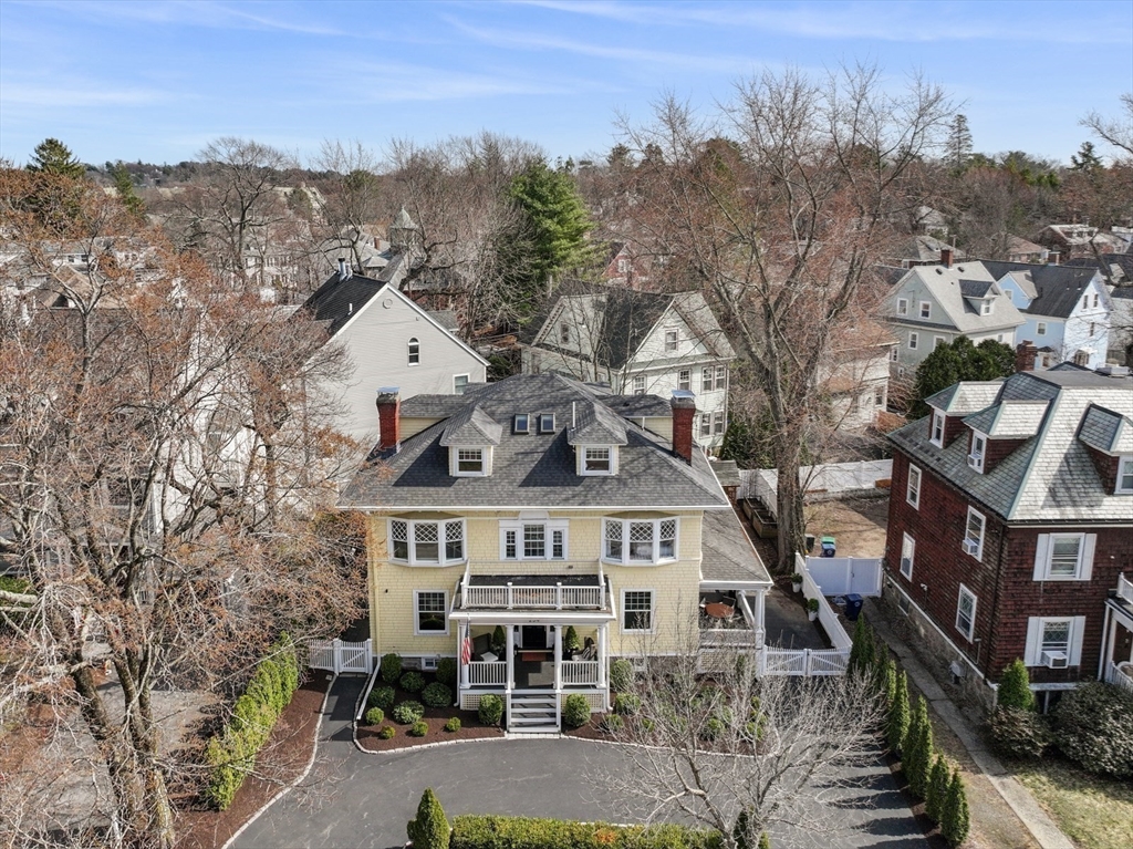 254 Commonwealth Avenue Newton, MA 02467 - Photo 37 of 37 a view of a big house with a big yard and large trees