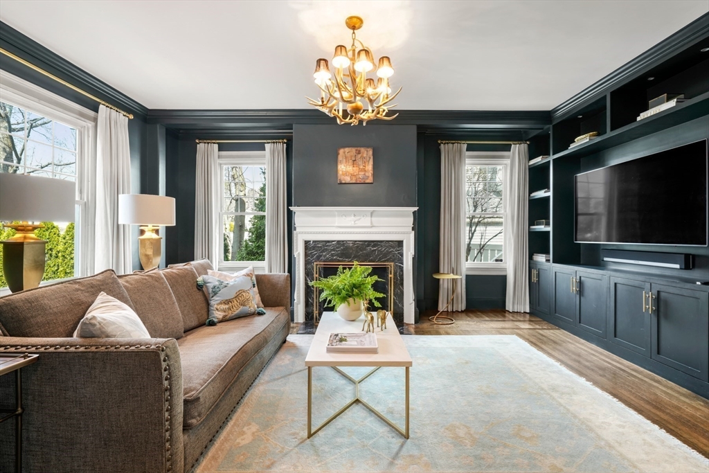 254 Commonwealth Avenue Newton, MA 02467 - Photo 8 of 37 a living room with fireplace furniture and a flat screen tv