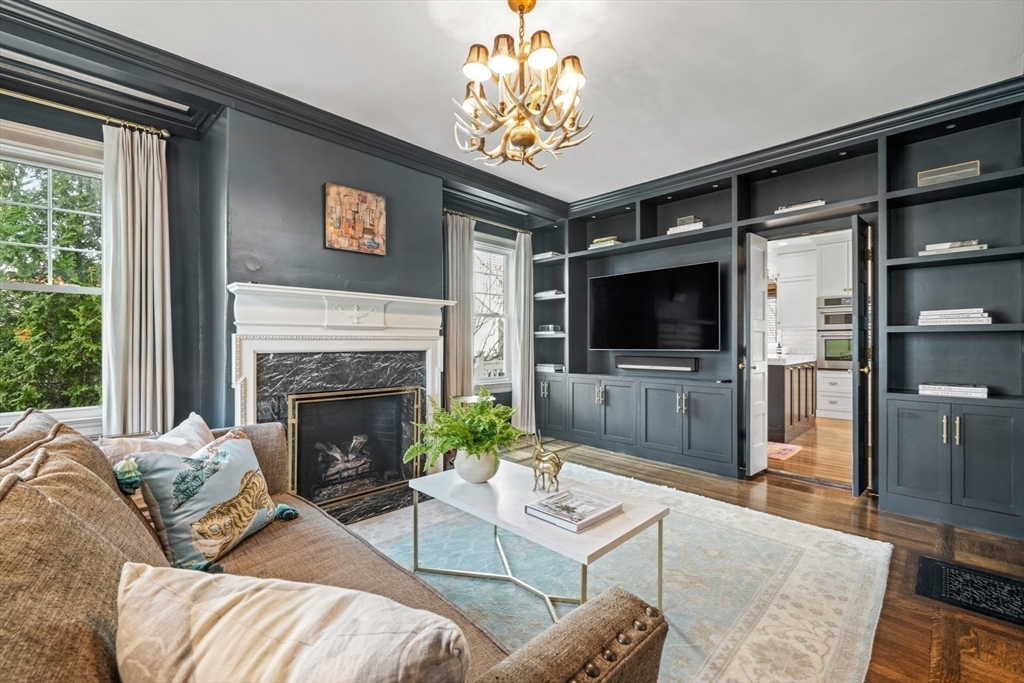 254 Commonwealth Avenue Newton, MA 02467 - Photo 9 of 37 a living room with furniture a flat screen tv and a fireplace