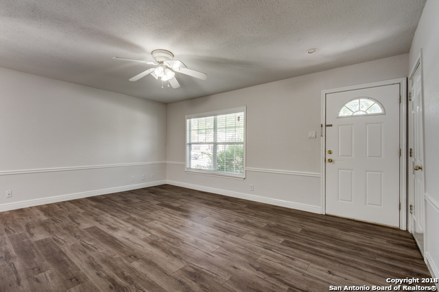 4838 Aspen Wood Kirby, TX 78219 - Photo 8 of 11 wooden floor in an empty room with a window