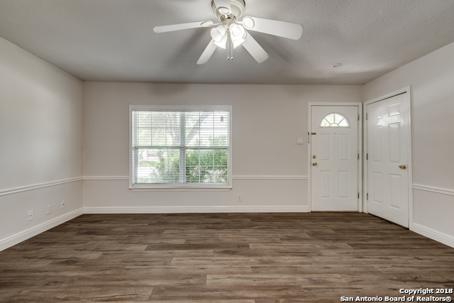 4838 Aspen Wood Kirby, TX 78219 - Photo 9 of 11 wooden floor in an empty room with a window