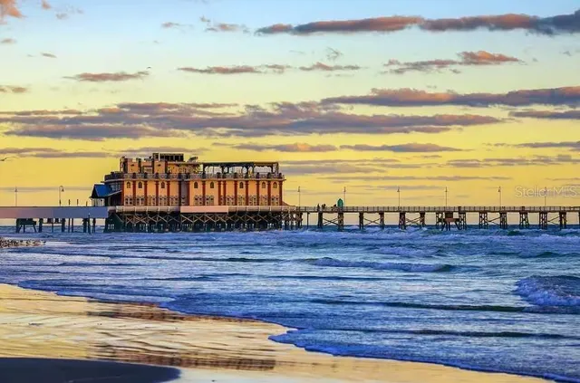 a view of a swimming pool with chairs
