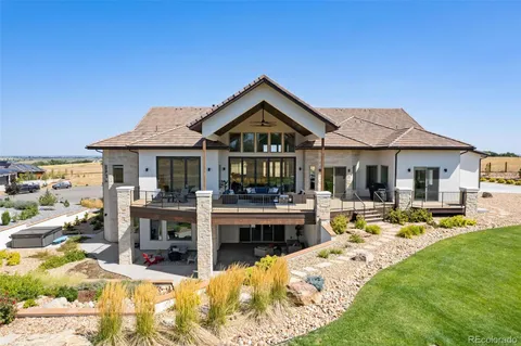 a view of house with swimming pool and furniture