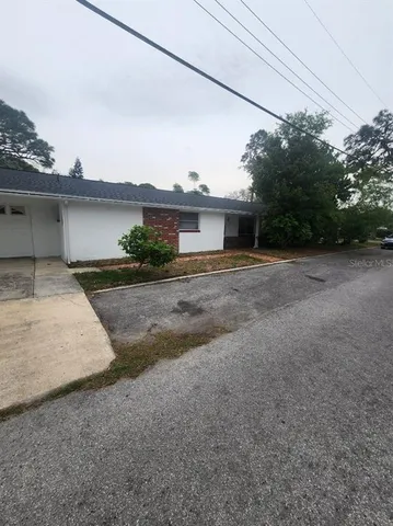 a view of a house with a street