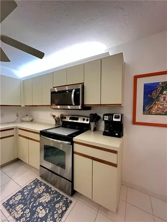 a kitchen with a sink cabinets and appliances