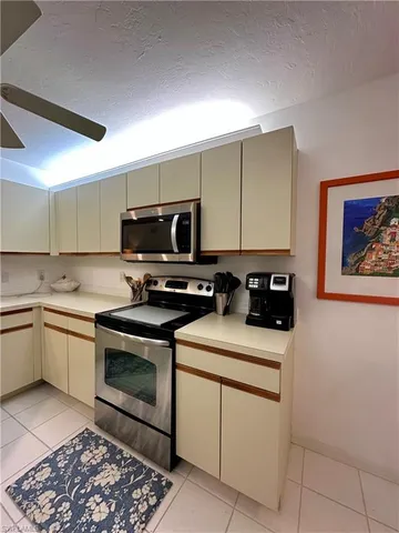 a kitchen with a sink cabinets and appliances