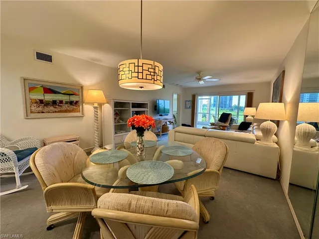 a view of a dining room with furniture