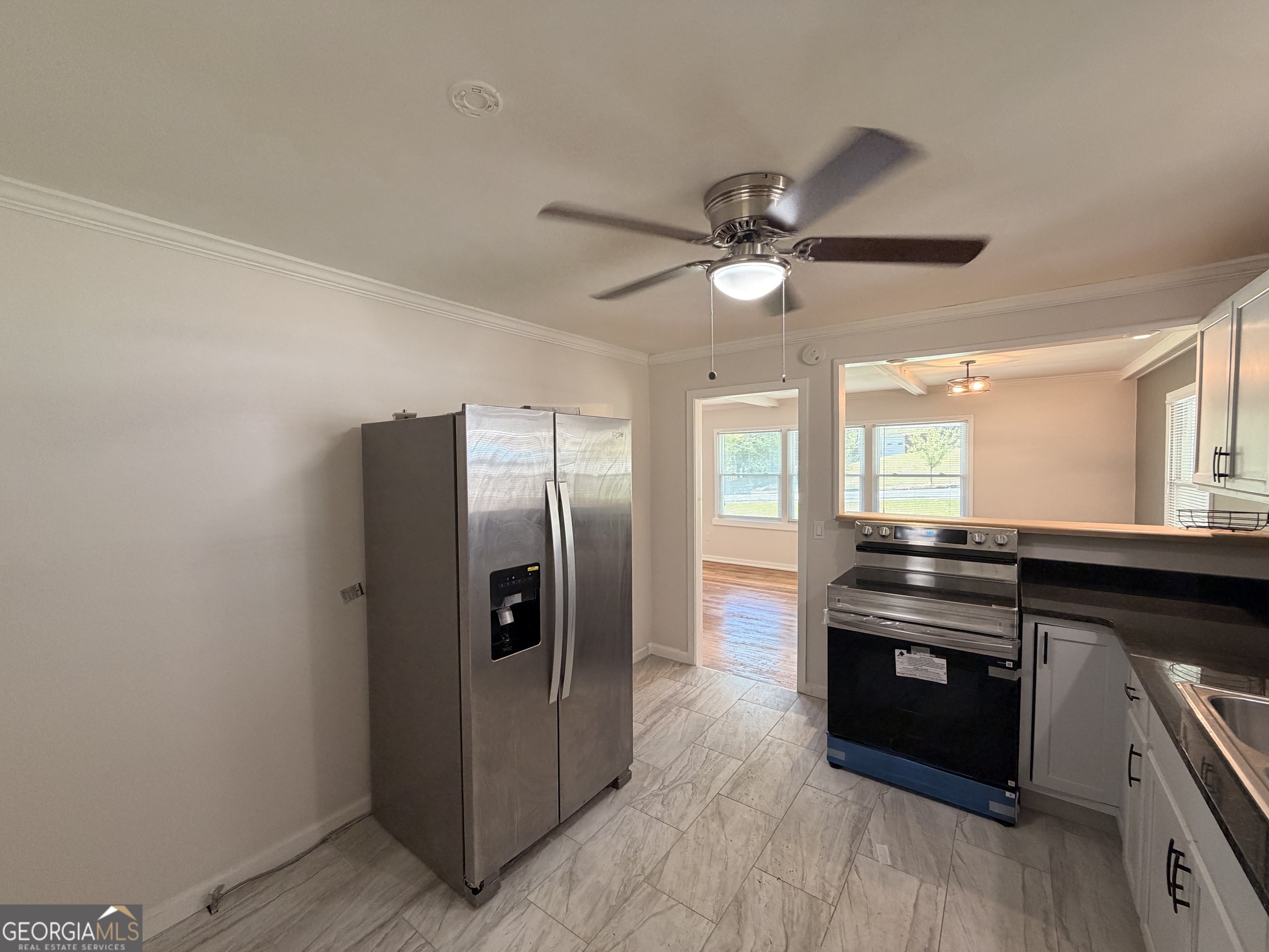 1734 Cahoon Street Southwest Atlanta, GA 30310 - Photo 15 of 29 a kitchen with granite countertop a refrigerator and a stove