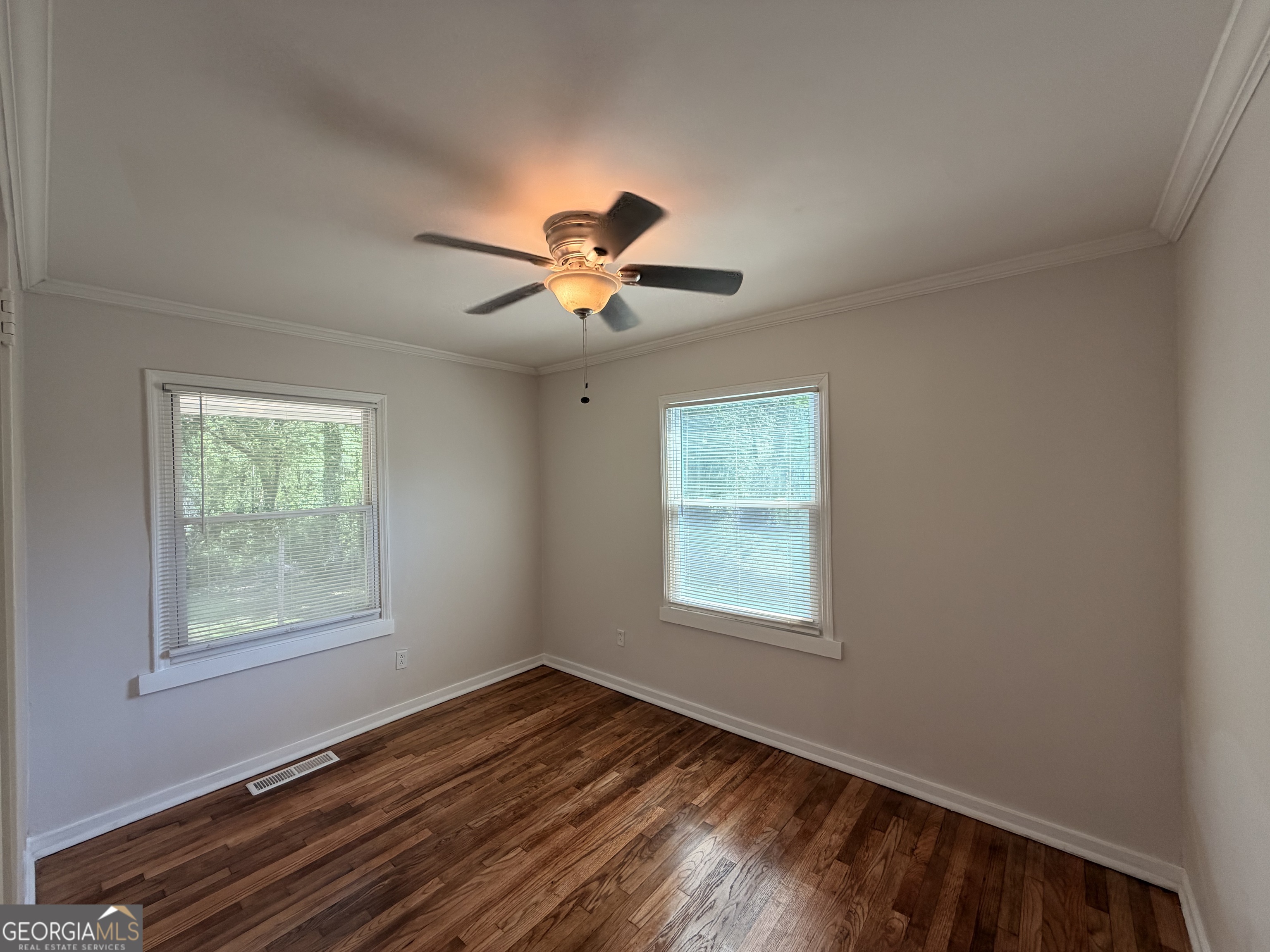 1734 Cahoon Street Southwest Atlanta, GA 30310 - Photo 20 of 29 wooden floor in an empty room with a window