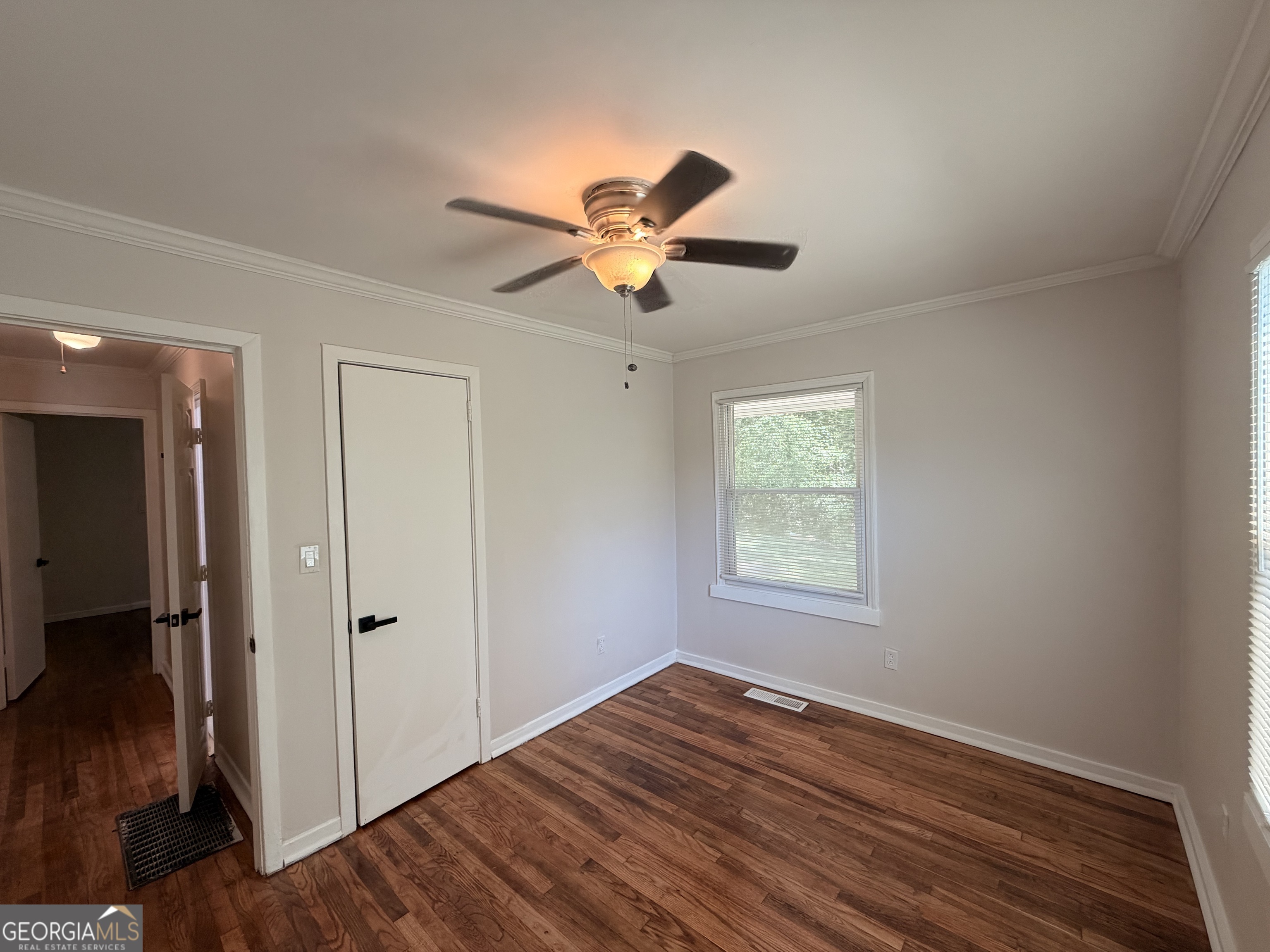 1734 Cahoon Street Southwest Atlanta, GA 30310 - Photo 21 of 29 a view of an empty room with window and wooden floor