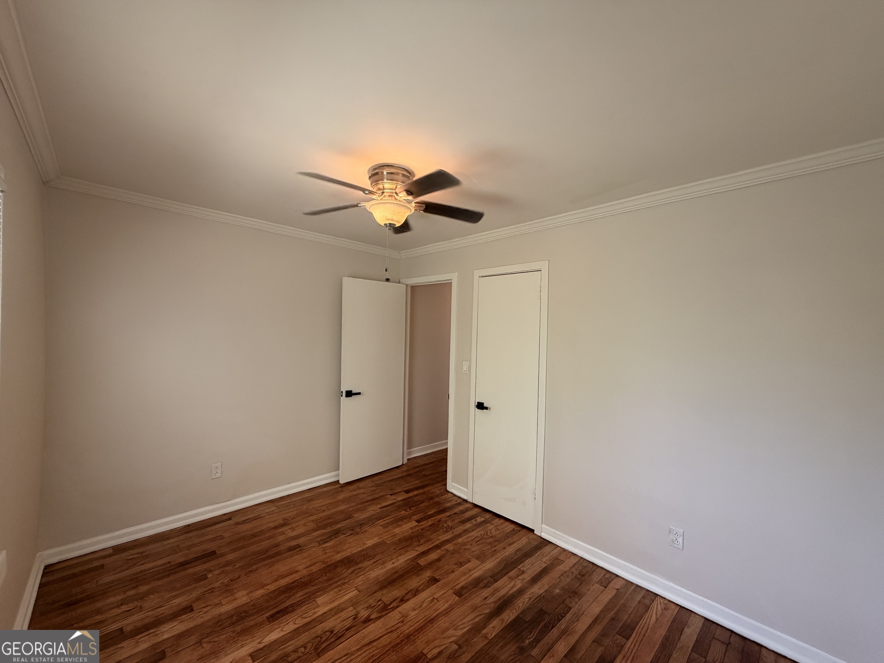 1734 Cahoon Street Southwest Atlanta, GA 30310 - Photo 22 of 29 a view of an empty room with wooden floor