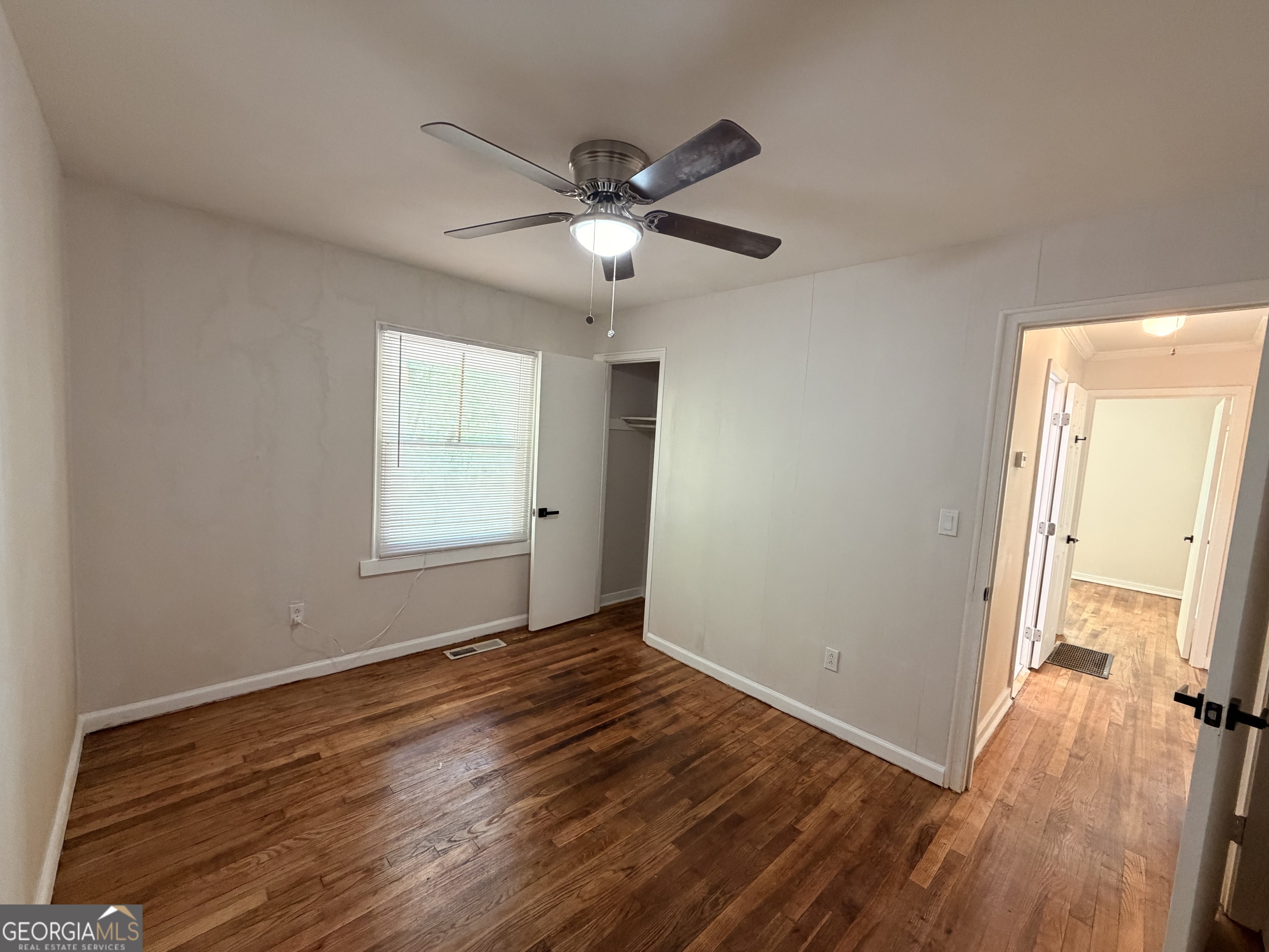 1734 Cahoon Street Southwest Atlanta, GA 30310 - Photo 25 of 29 a view of empty room with wooden floor and fan