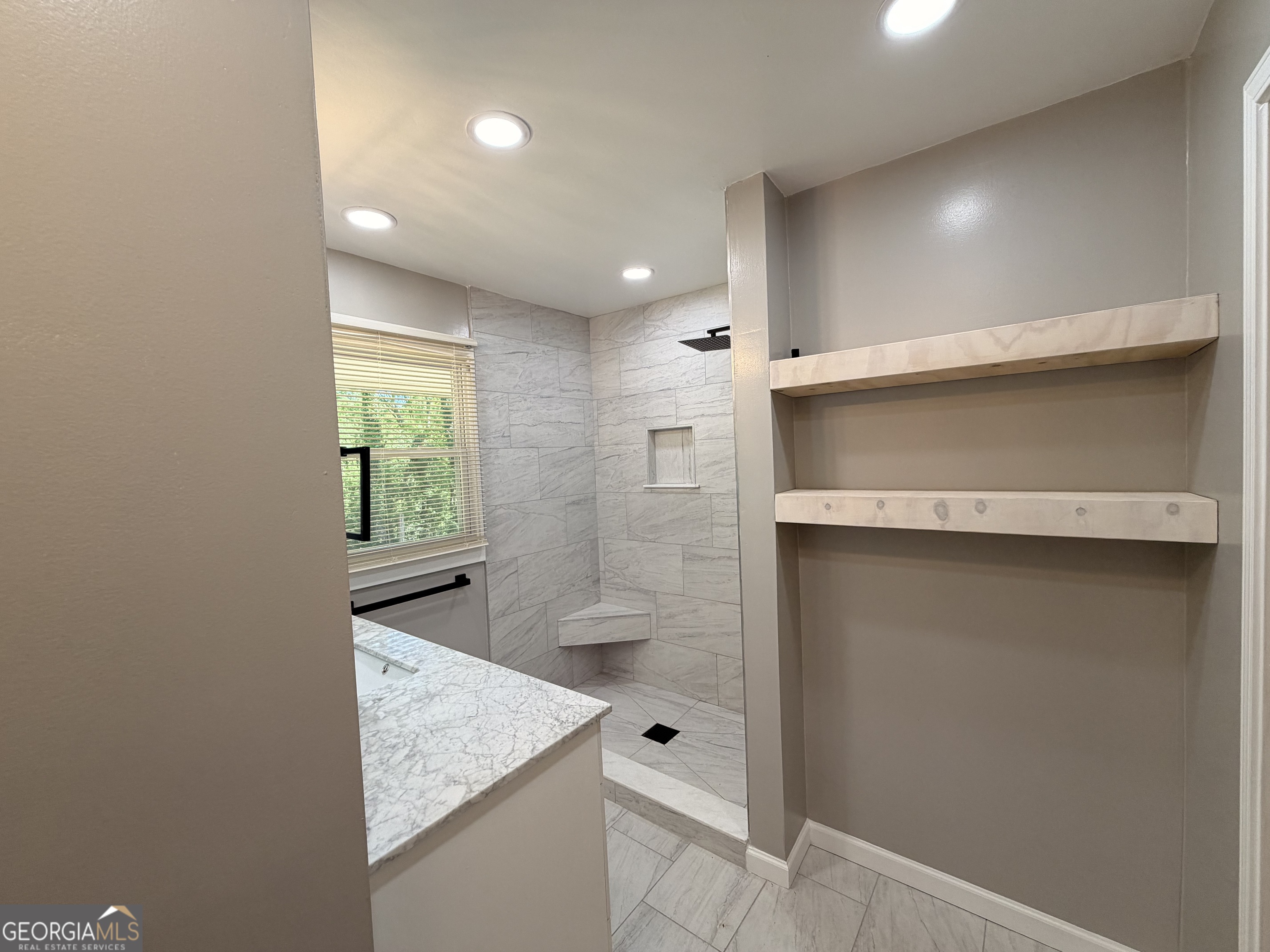 1734 Cahoon Street Southwest Atlanta, GA 30310 - Photo 27 of 29 a bathroom with a granite countertop sink a toilet and shower
