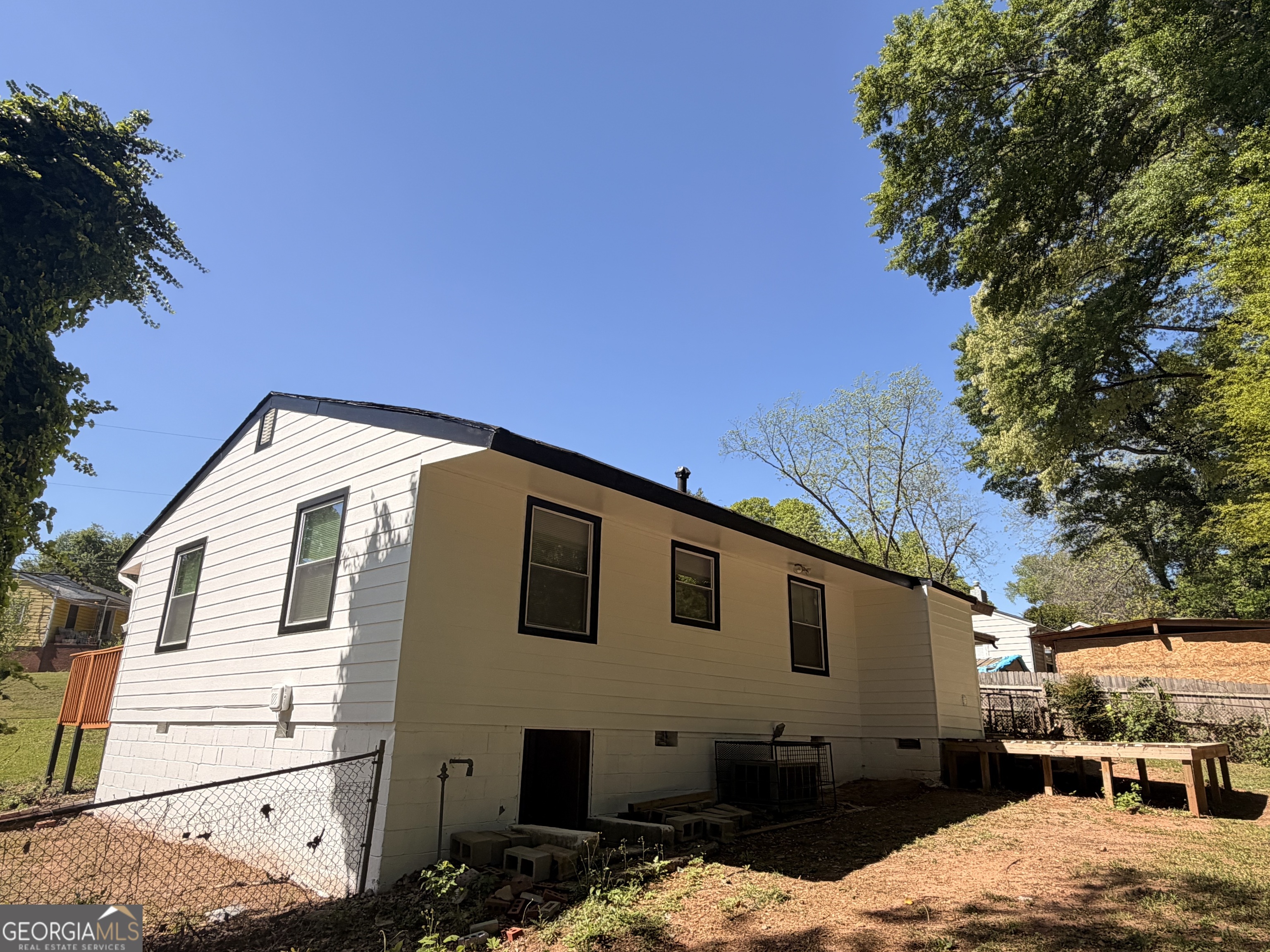 1734 Cahoon Street Southwest Atlanta, GA 30310 - Photo 4 of 29 a front view of a house with a backyard