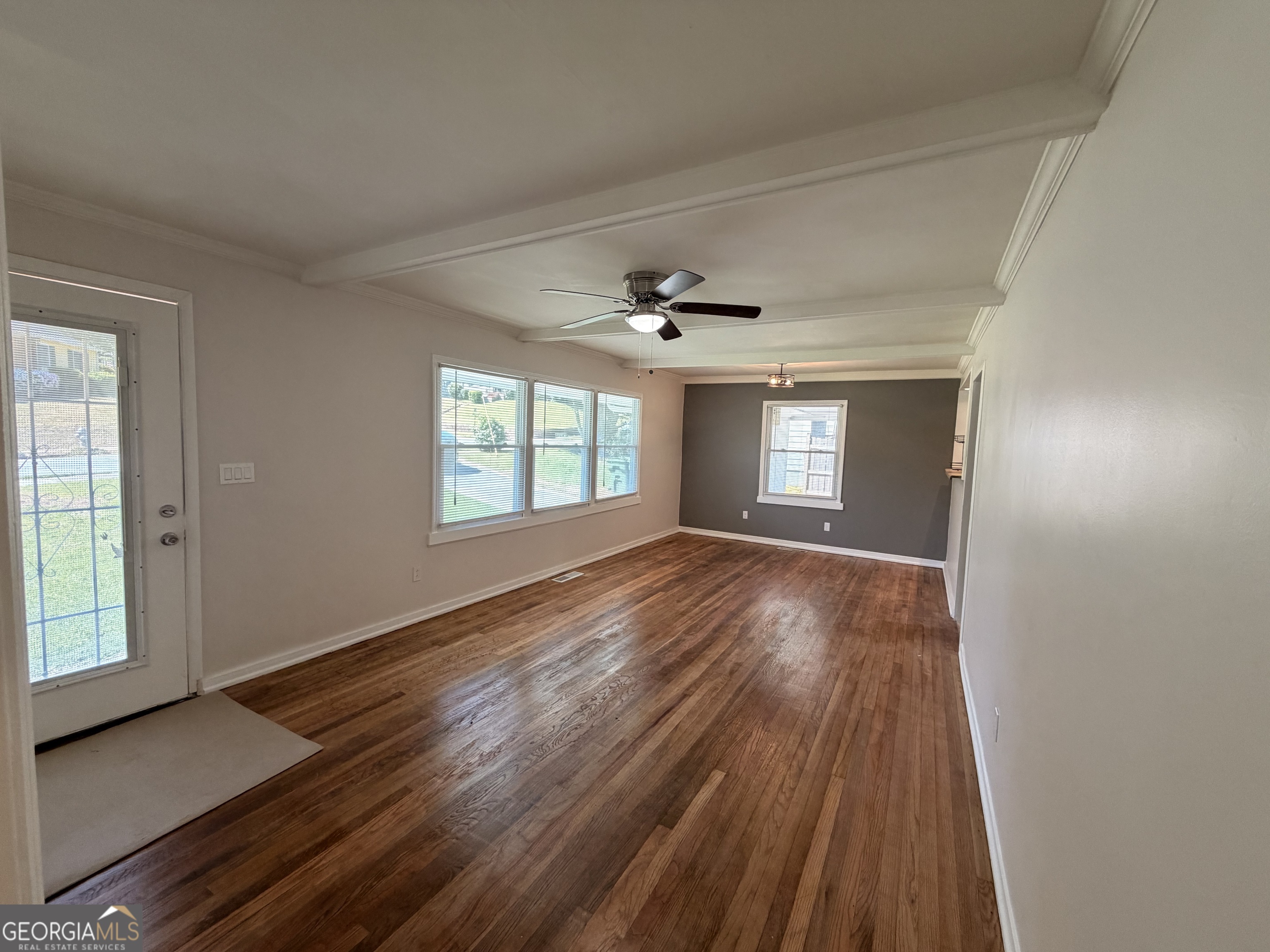 1734 Cahoon Street Southwest Atlanta, GA 30310 - Photo 10 of 29 a view of an empty room with wooden floor and a window