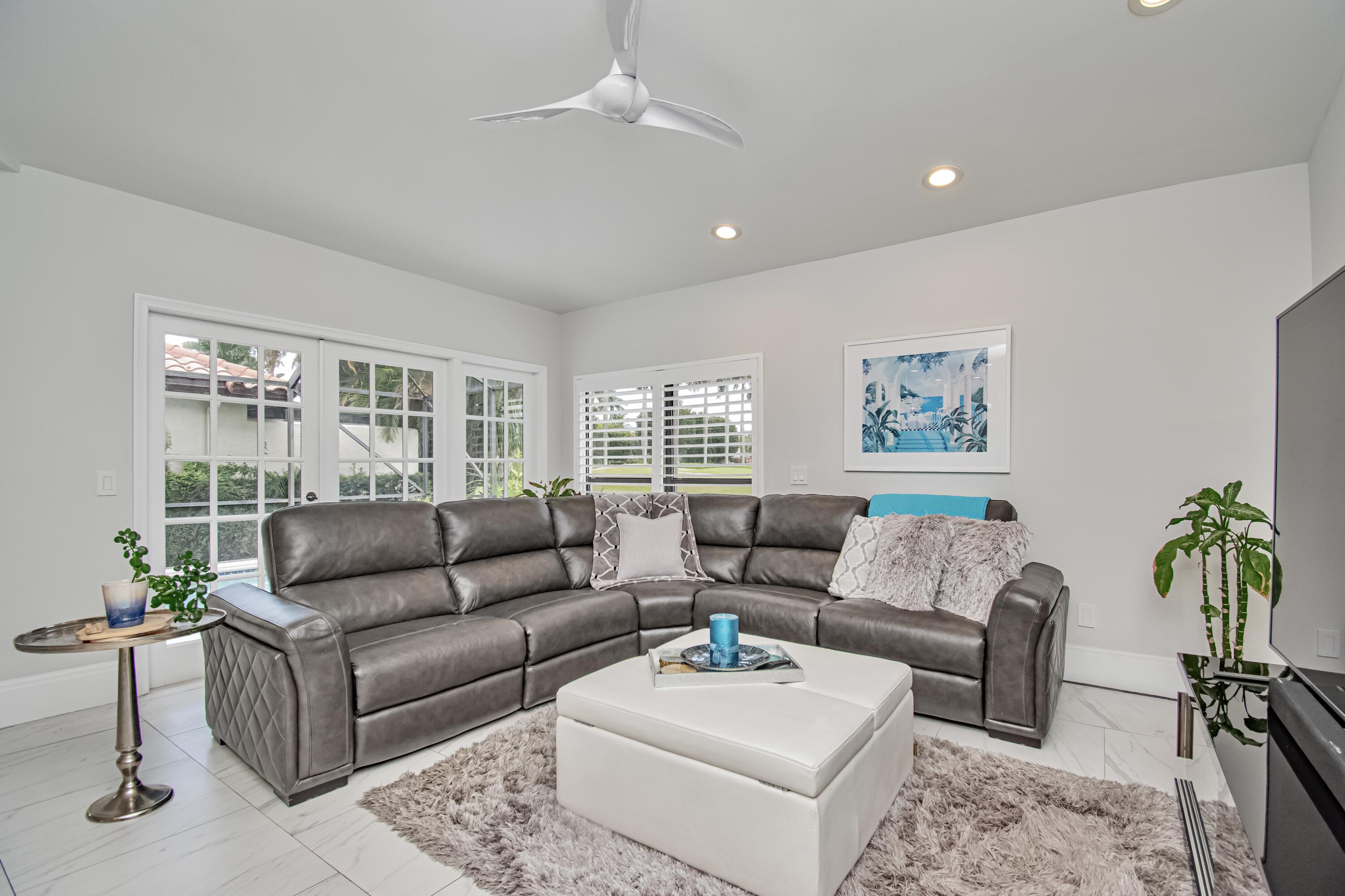 22504 Esplanada Circle Boca Raton, FL 33433 - Photo 16 of 47 a living room with furniture and a potted plant