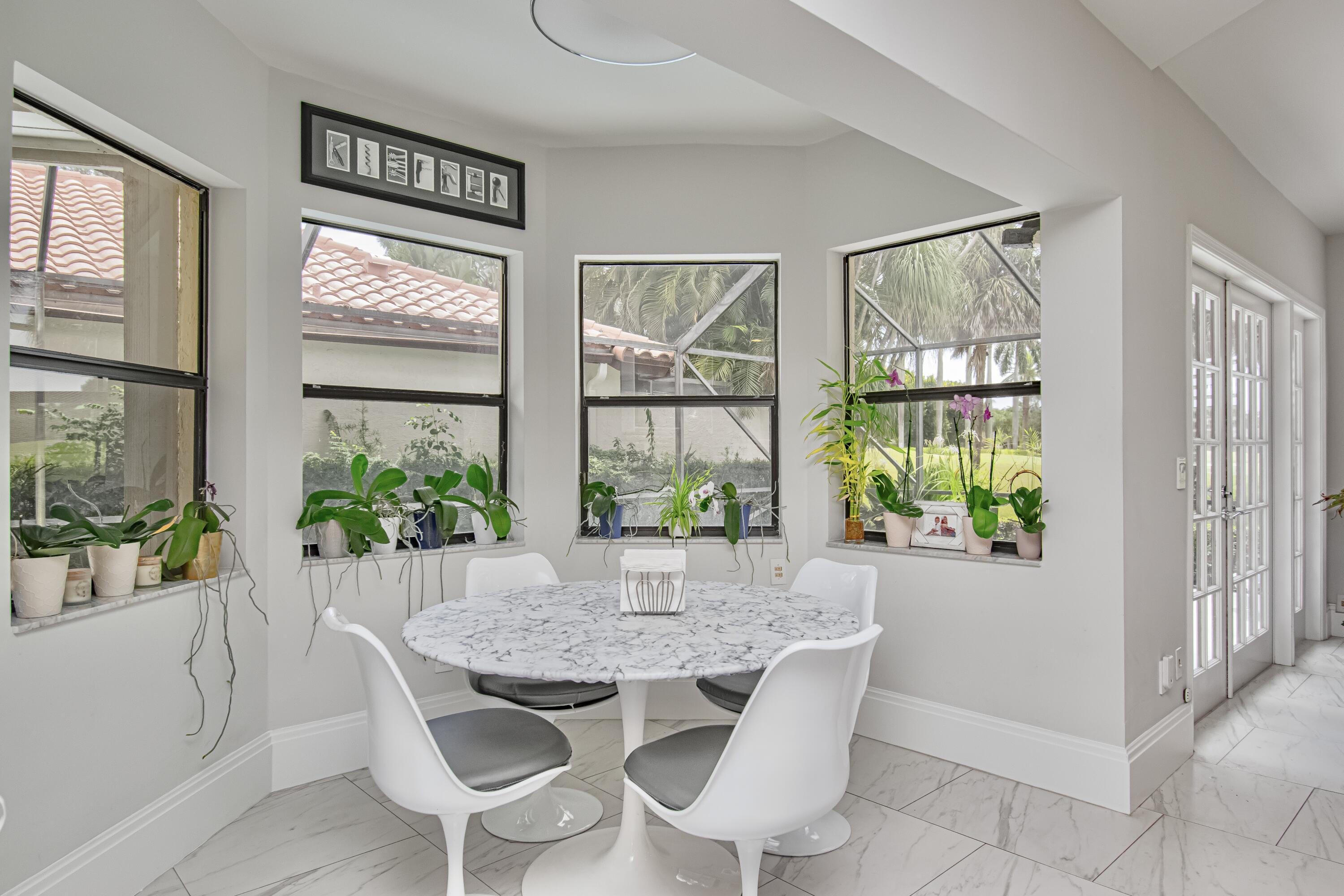 22504 Esplanada Circle Boca Raton, FL 33433 - Photo 18 of 47 a view of a dining room with furniture window and wooden floor