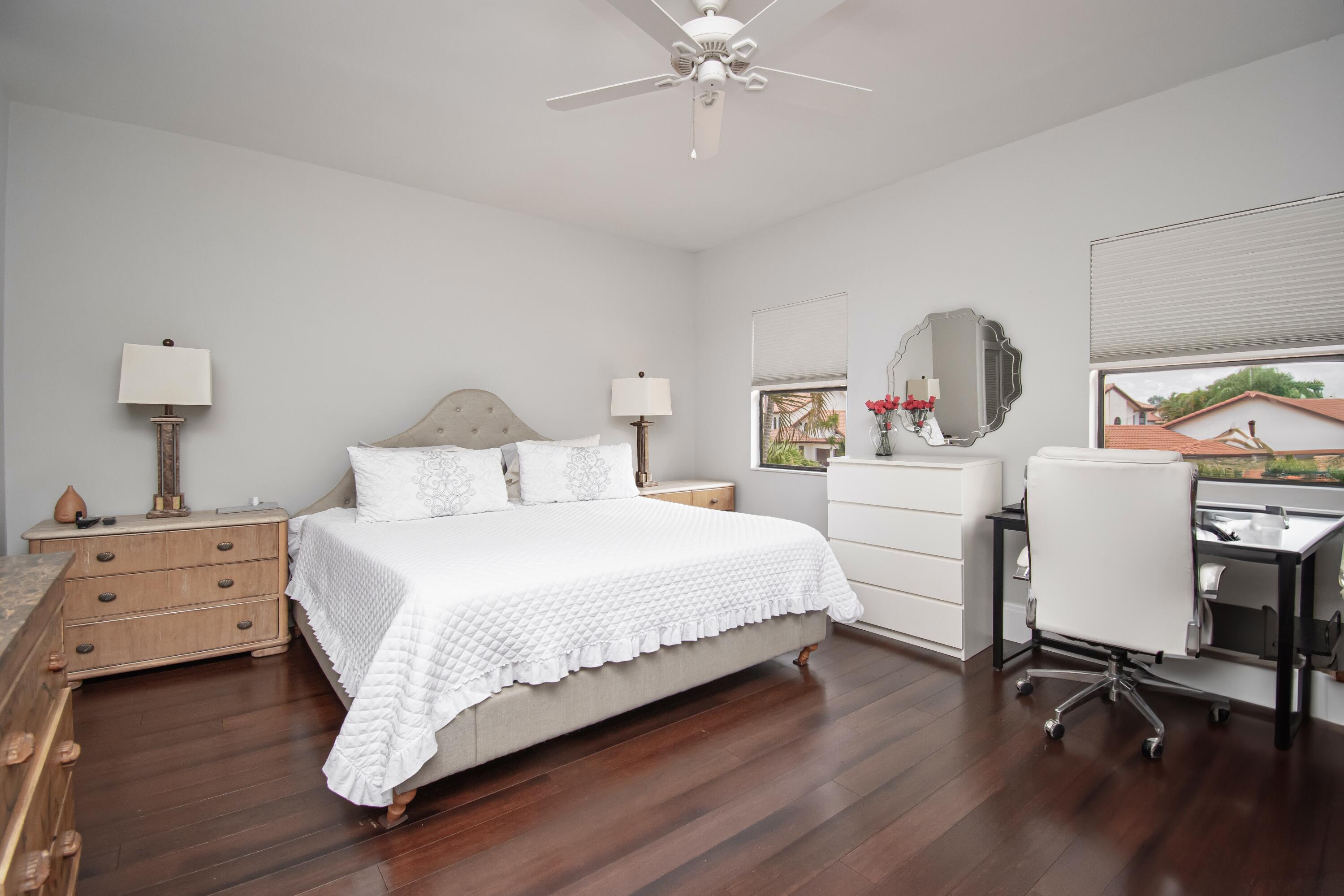 22504 Esplanada Circle Boca Raton, FL 33433 - Photo 28 of 47 a bedroom with a bed and a desk