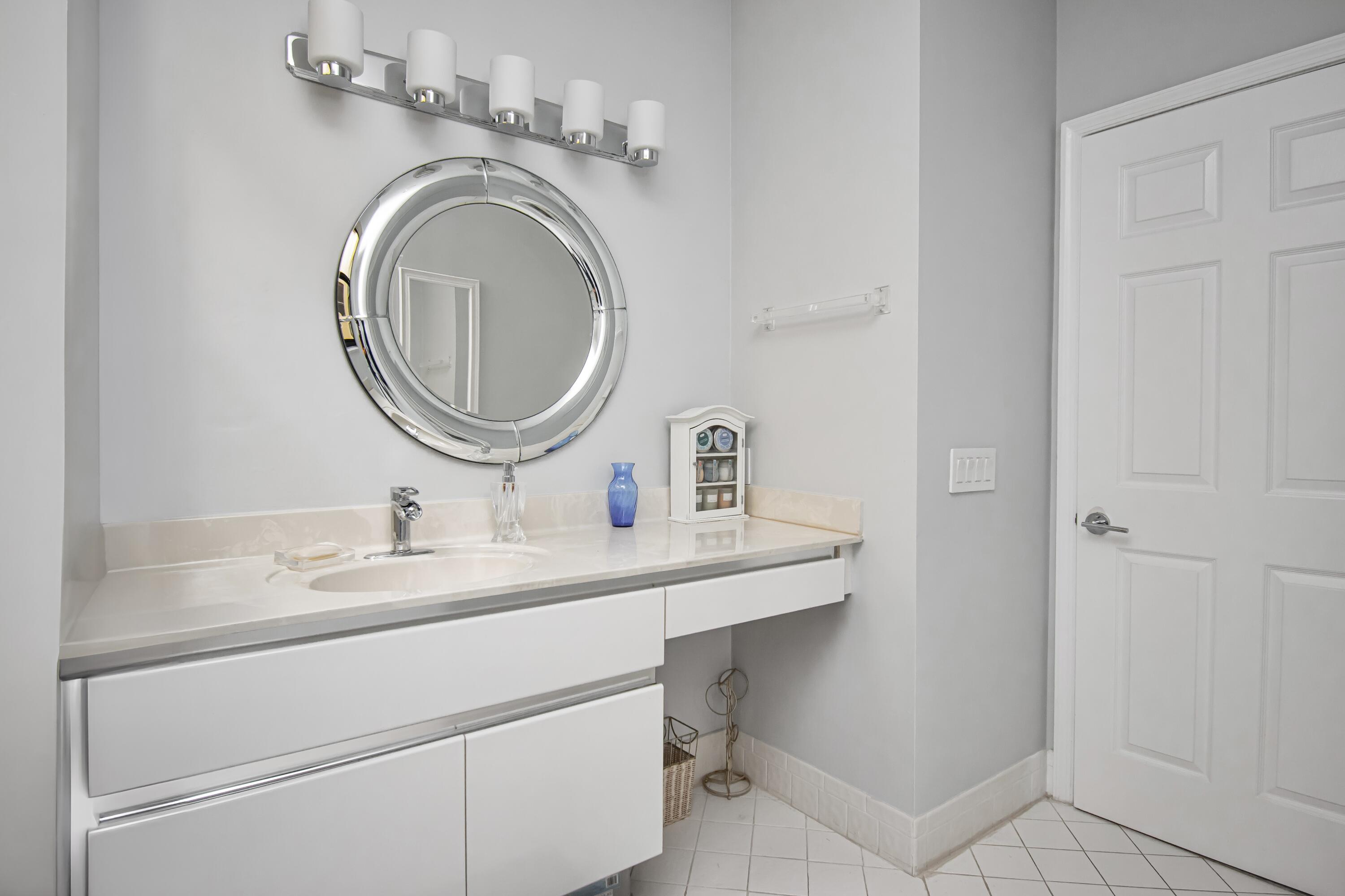 22504 Esplanada Circle Boca Raton, FL 33433 - Photo 29 of 47 a bathroom with a sink and a mirror