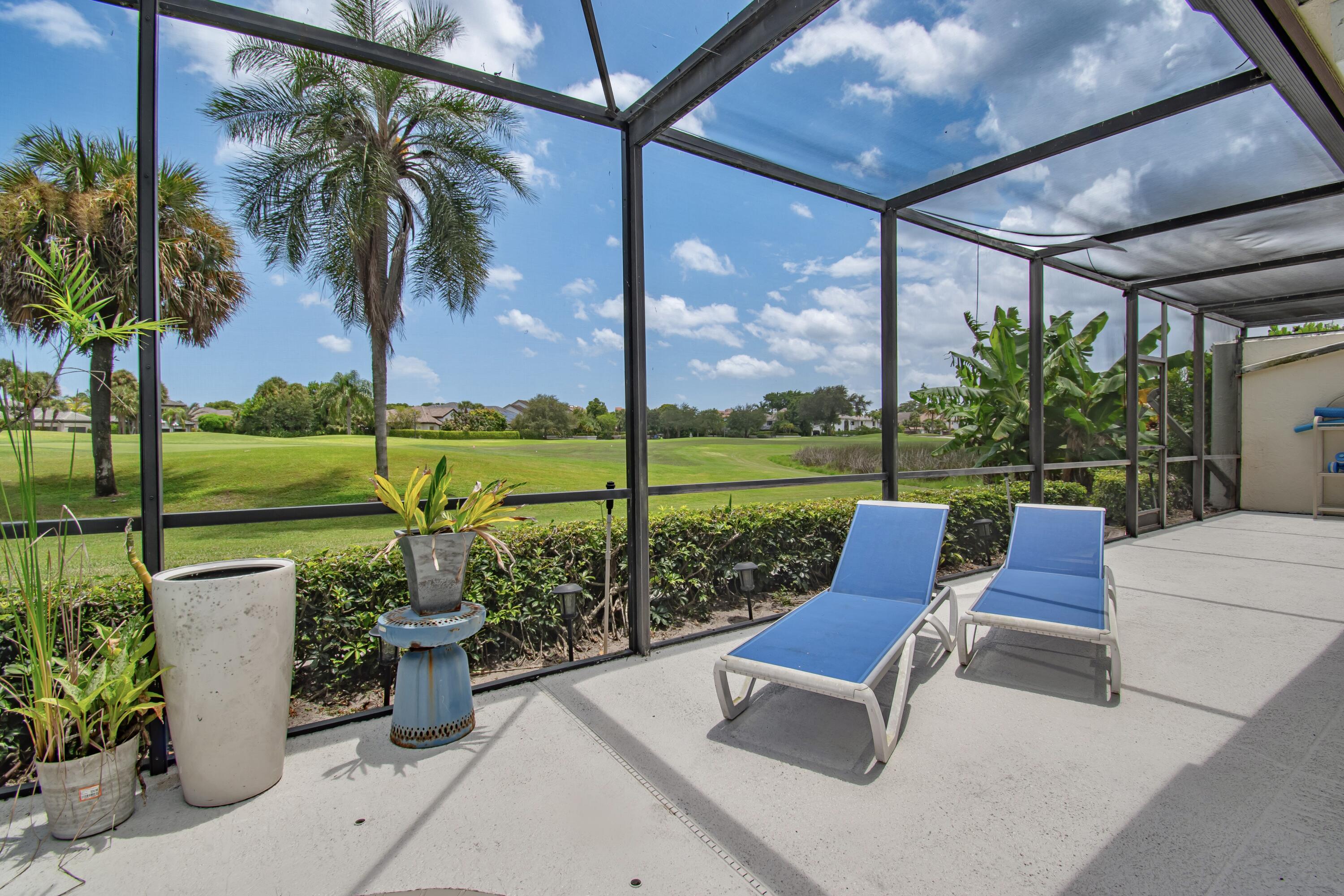22504 Esplanada Circle Boca Raton, FL 33433 - Photo 35 of 47 a view of a patio with chairs and plants
