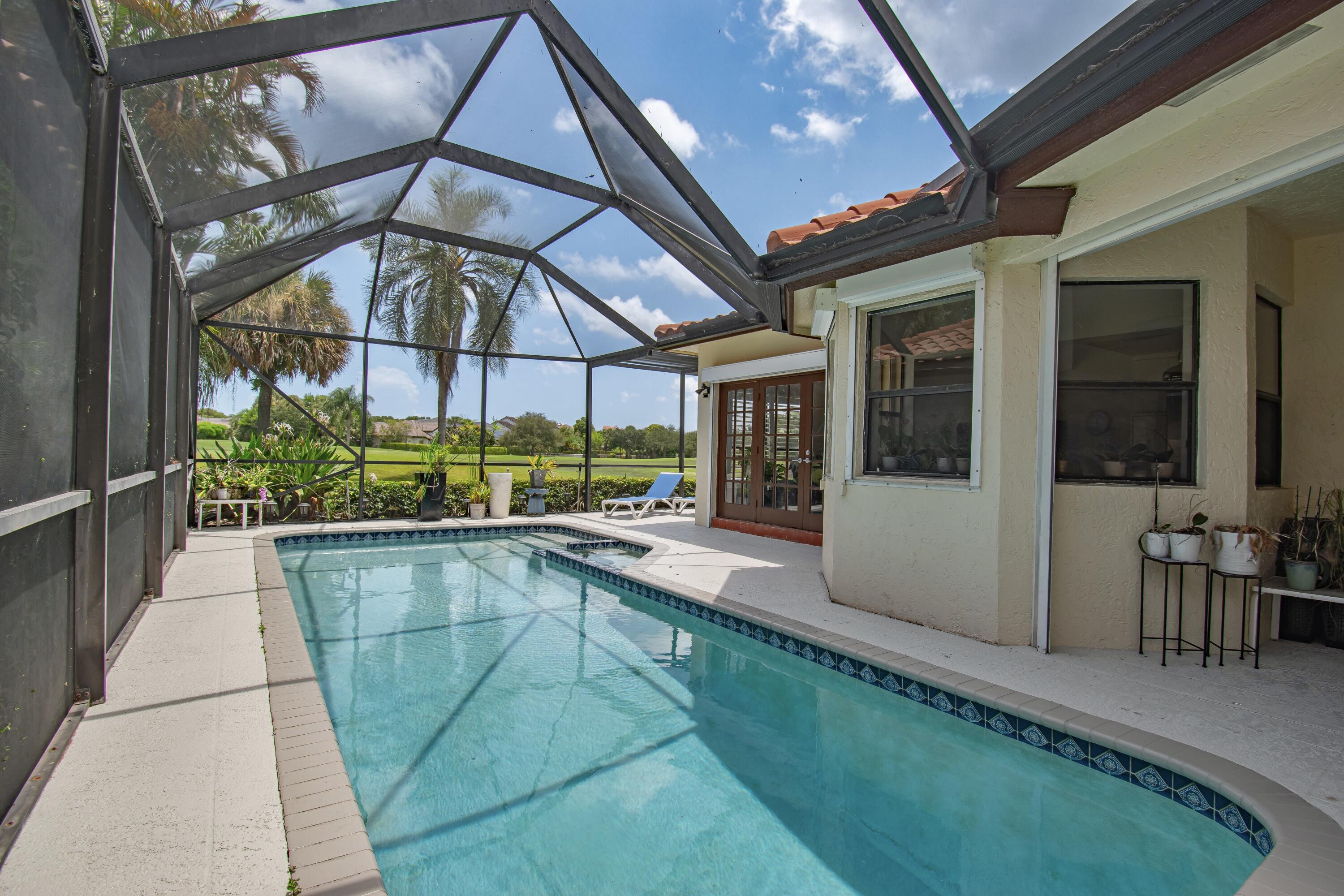 22504 Esplanada Circle Boca Raton, FL 33433 - Photo 36 of 47 a view of a house with a swimming pool and sitting area