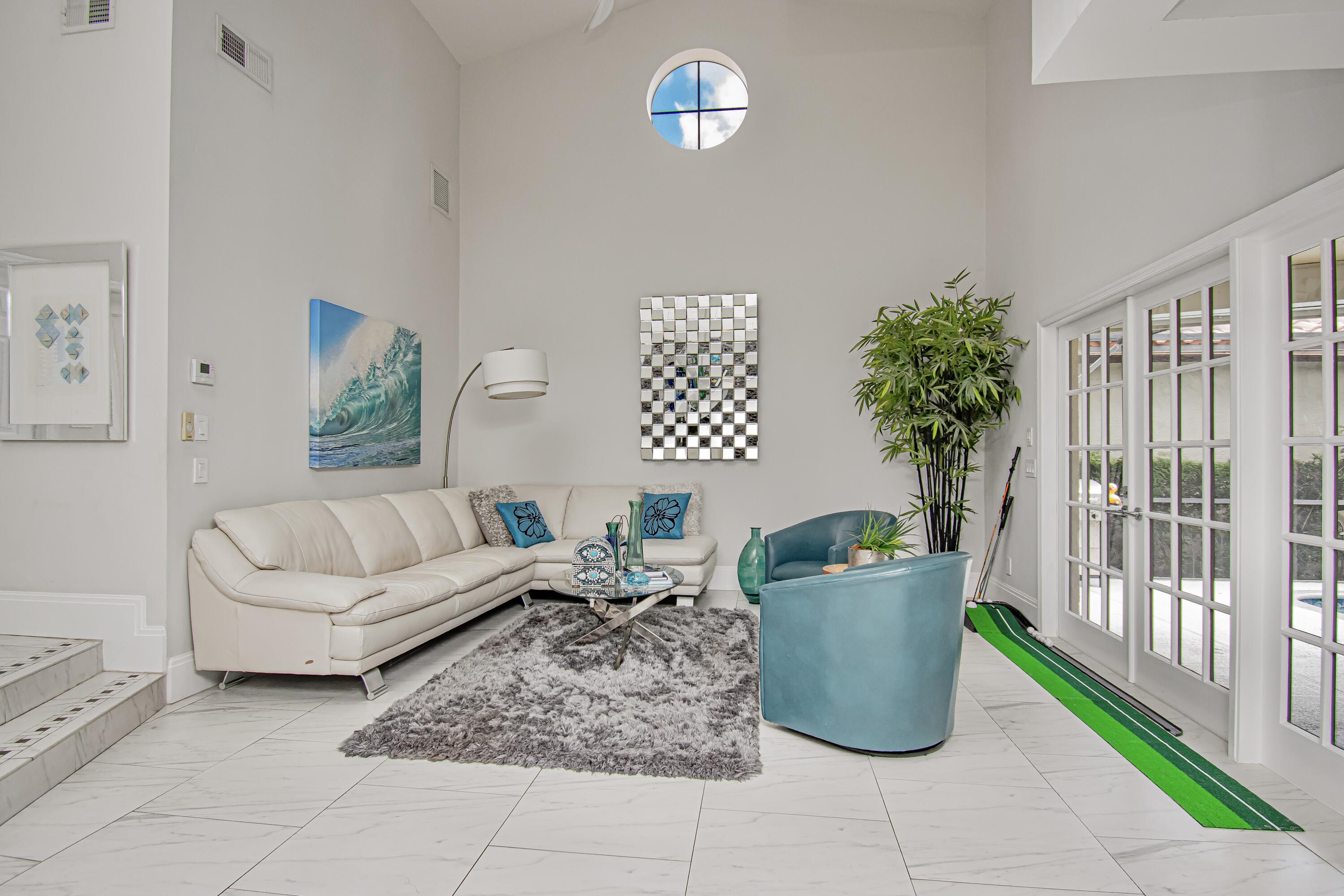 22504 Esplanada Circle Boca Raton, FL 33433 - Photo 7 of 47 a living room with furniture and a floor to ceiling window