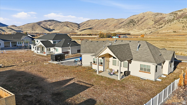 534 East Fish Hatchery Road Mantua, UT 84324 - Photo 66 of 87 Aerial perspective of suburban area with a mountainous background