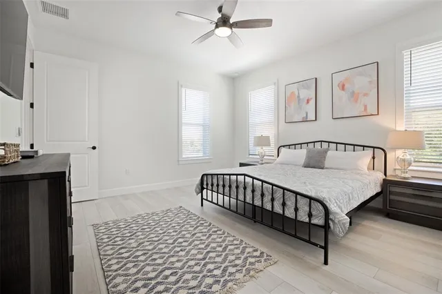 a bedroom with a bed and window