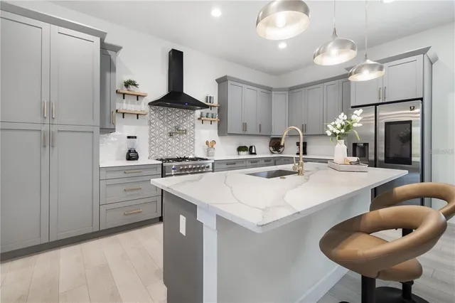 a kitchen with cabinets a sink and white appliances