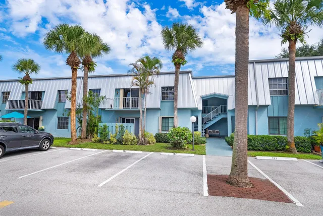 a front view of residential houses with street