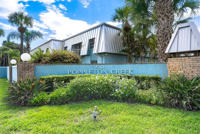 a view of a house with a yard and plants