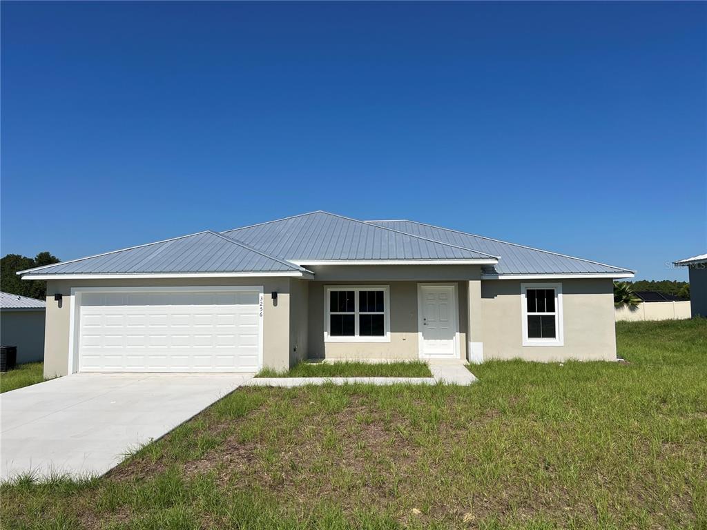 a front view of house with yard