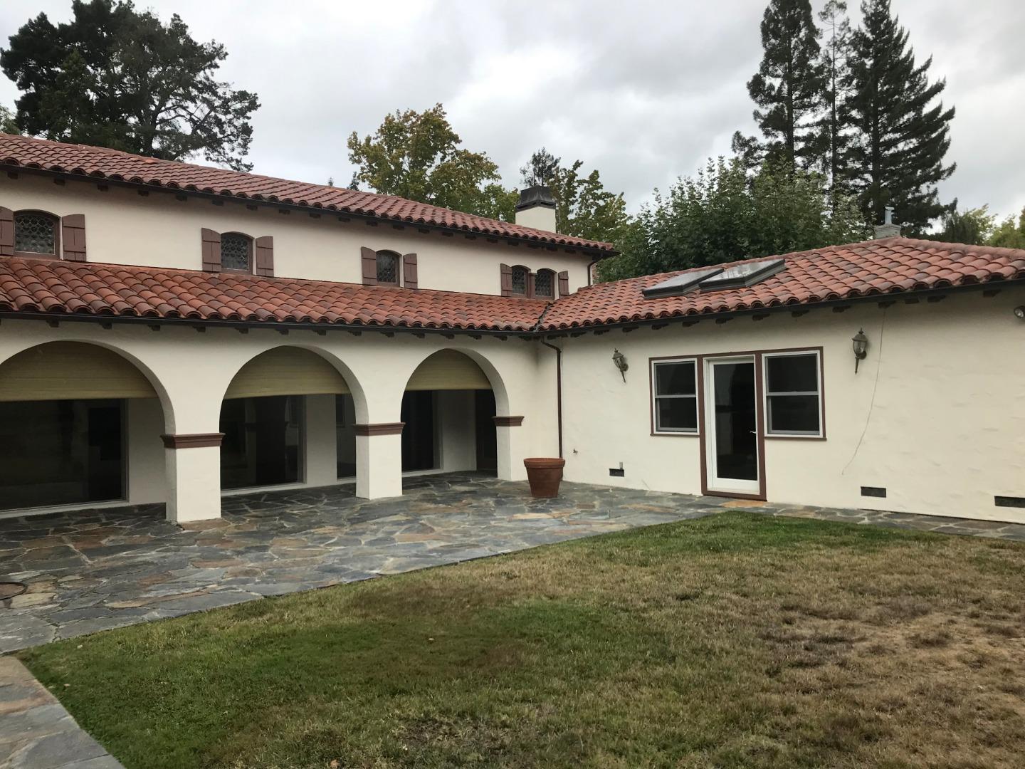 475 Roblar Avenue Hillsborough, CA 94010 - Photo 2 of 2 a front view of a house with a garden