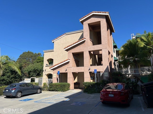 918 West Garvey Avenue, Unit 103 Monterey Park, CA 91754 - Photo 1 of 25 a front view of a house with a garden