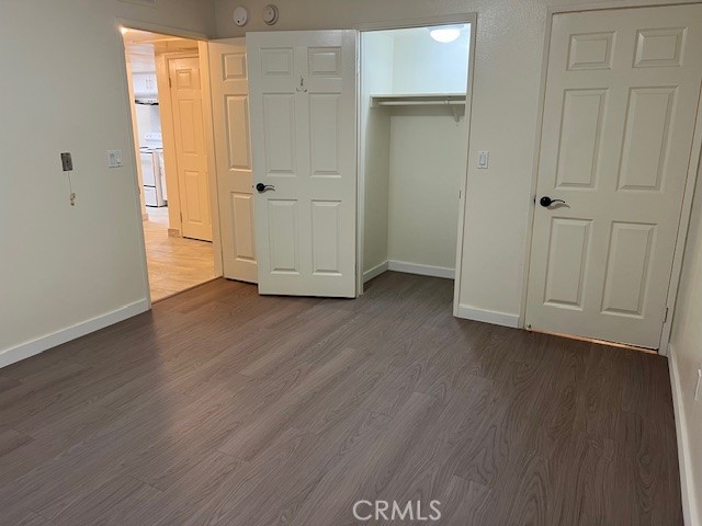 918 West Garvey Avenue, Unit 103 Monterey Park, CA 91754 - Photo 13 of 25 an empty room with wooden floor and closet area
