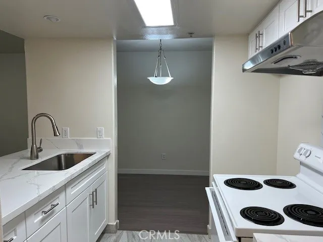 a close view of sink and cabinets