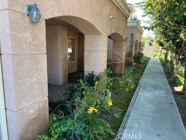 918 West Garvey Avenue, Unit 103 Monterey Park, CA 91754 - Photo 22 of 25 a couple of flower plants in front of door