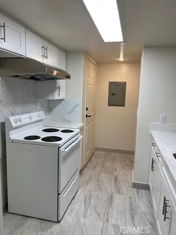 a kitchen with a stove and a sink