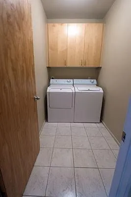 a bathroom with a sink double vanity and a mirror