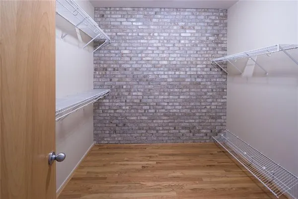 a bathroom with a shower and a glass door