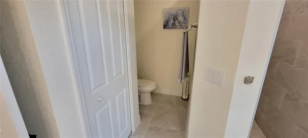 a view of a bathroom from a hallway