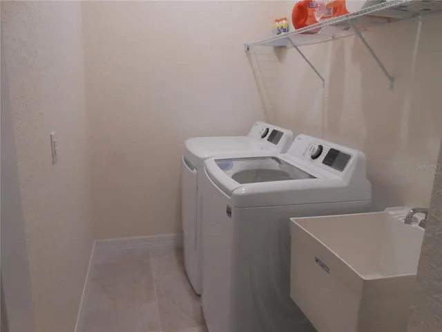 a utility room with dryer and washer