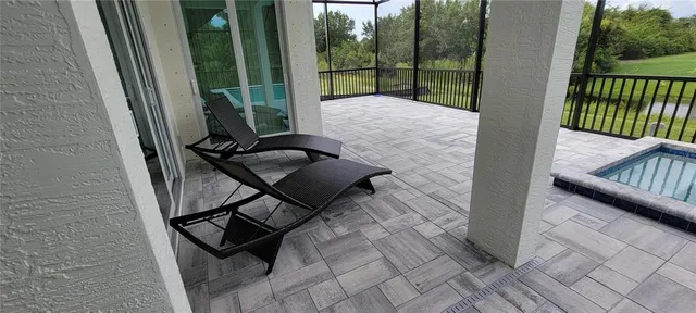 a view of a dining room with furniture window and outside view