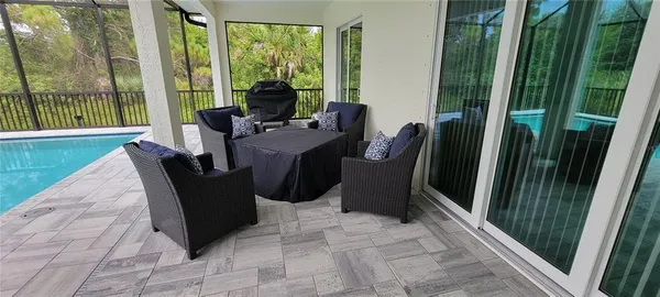 a view of swimming pool with patio