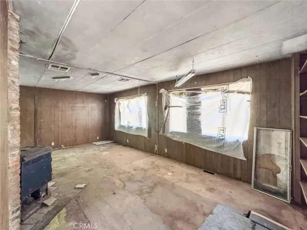 a view of an empty room with stairs