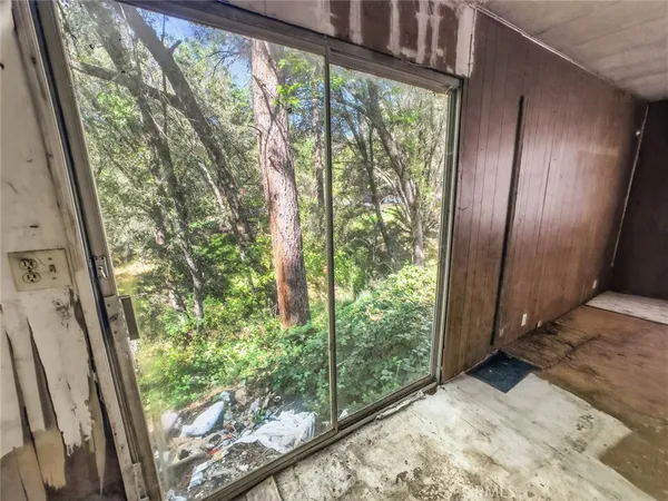 a view of a kitchen with furniture and a window
