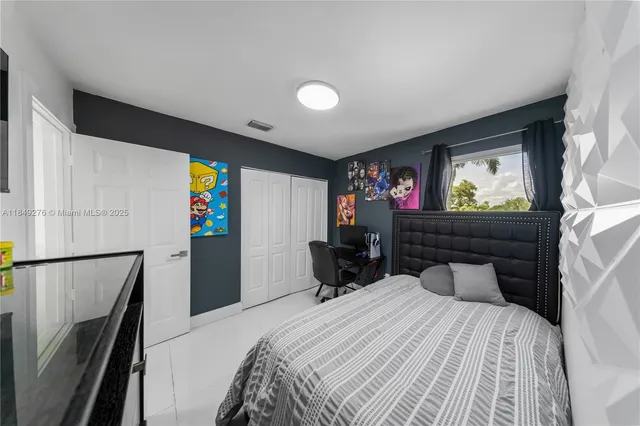 a bedroom with a bed and furniture