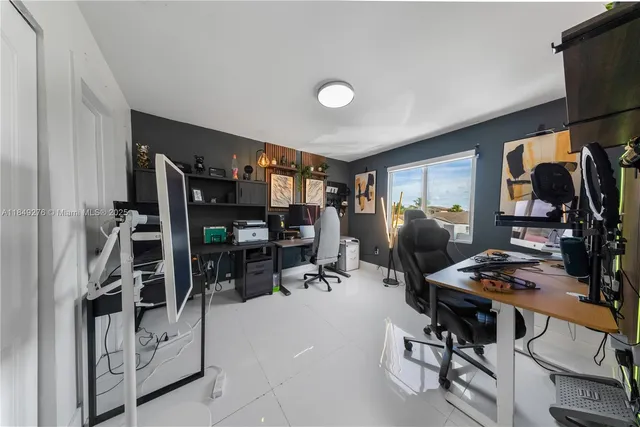 a view of a workspace with furniture