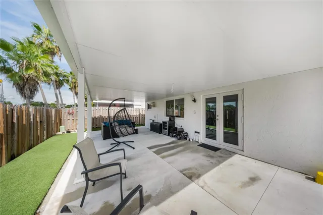 a view of a chairs and tables in patio of the house